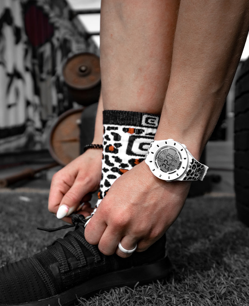 Athlete wearing White coliseum forum edition watch