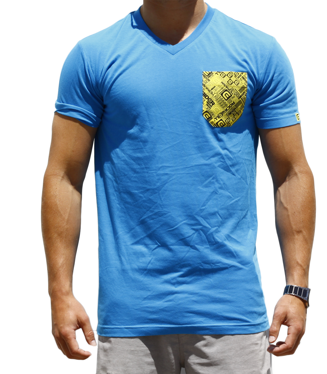 Man wearing the blue boss v neck with yellow chest pocket with Rockwell logo on it